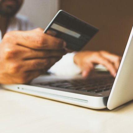 Shopping online using a laptop and credit card